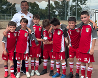 Bambini felici dopo una partita di calcio con la scuola La Pelota di Aprilia
